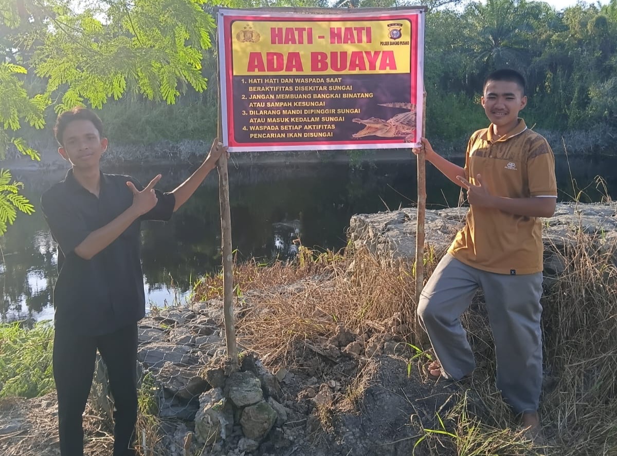 Cegah Konflik Manusia dan Buaya, Polsek Bangko Pusako Pasang Spanduk Peringatan